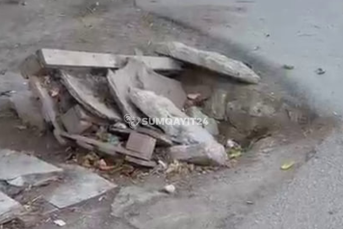 Daş və taxta ilə "təhlükəsizlik": Sumqayıtda kanalizasiya lükü