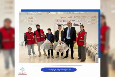 QAC ehtiyacı olan uşaqları qış geyimləri ilə təmin edib