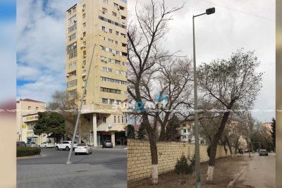 Əyilən vəziyyətdə qalan dirəklər sakinləri narahat edir