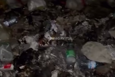 "Elə bil burada insan yaşamır": Yaşıl Dərə zibil içində